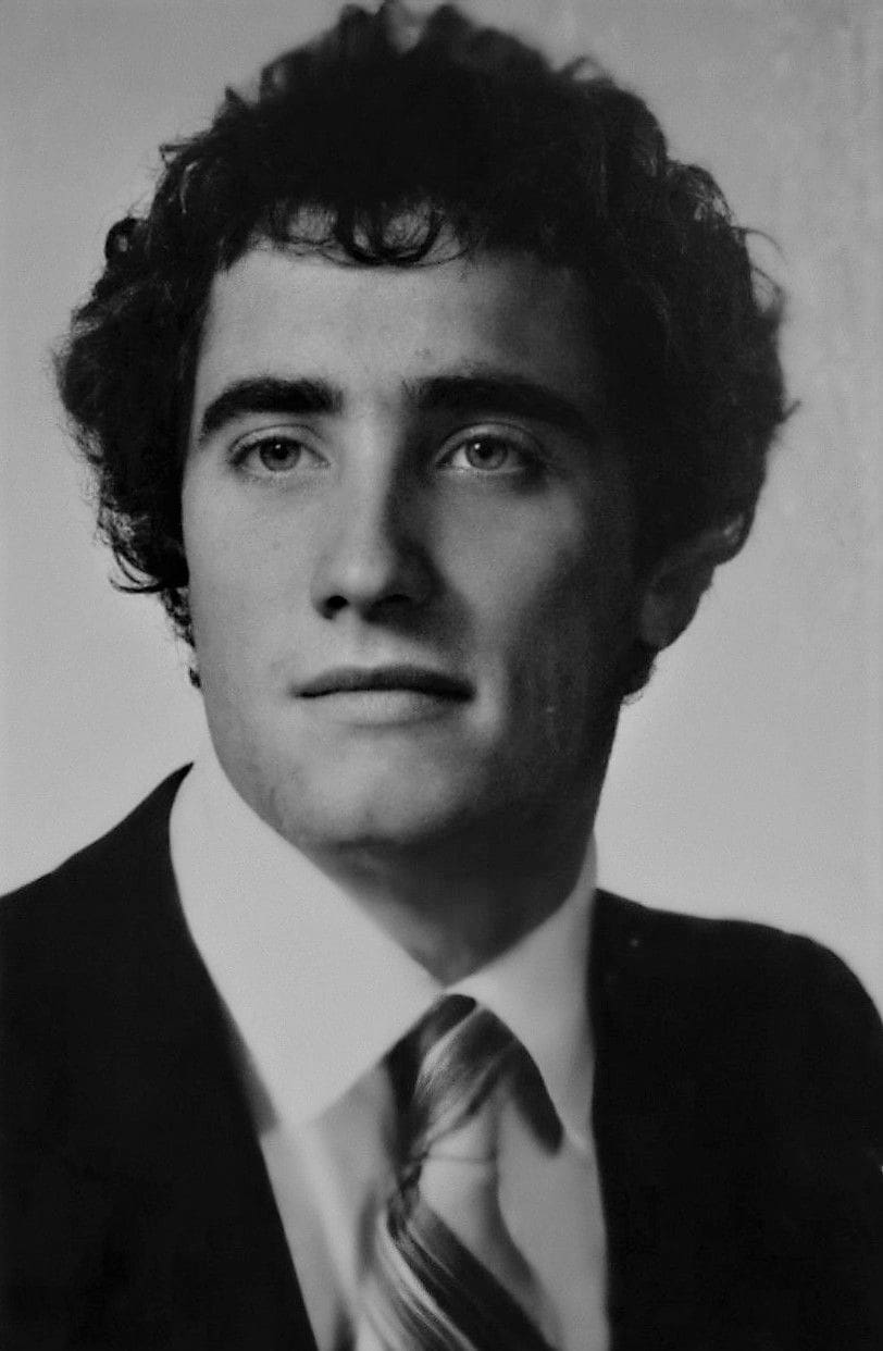Black and white portrait of a young man.