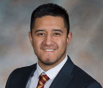 Jorge Robles Professional headshot of a young man in suit.
