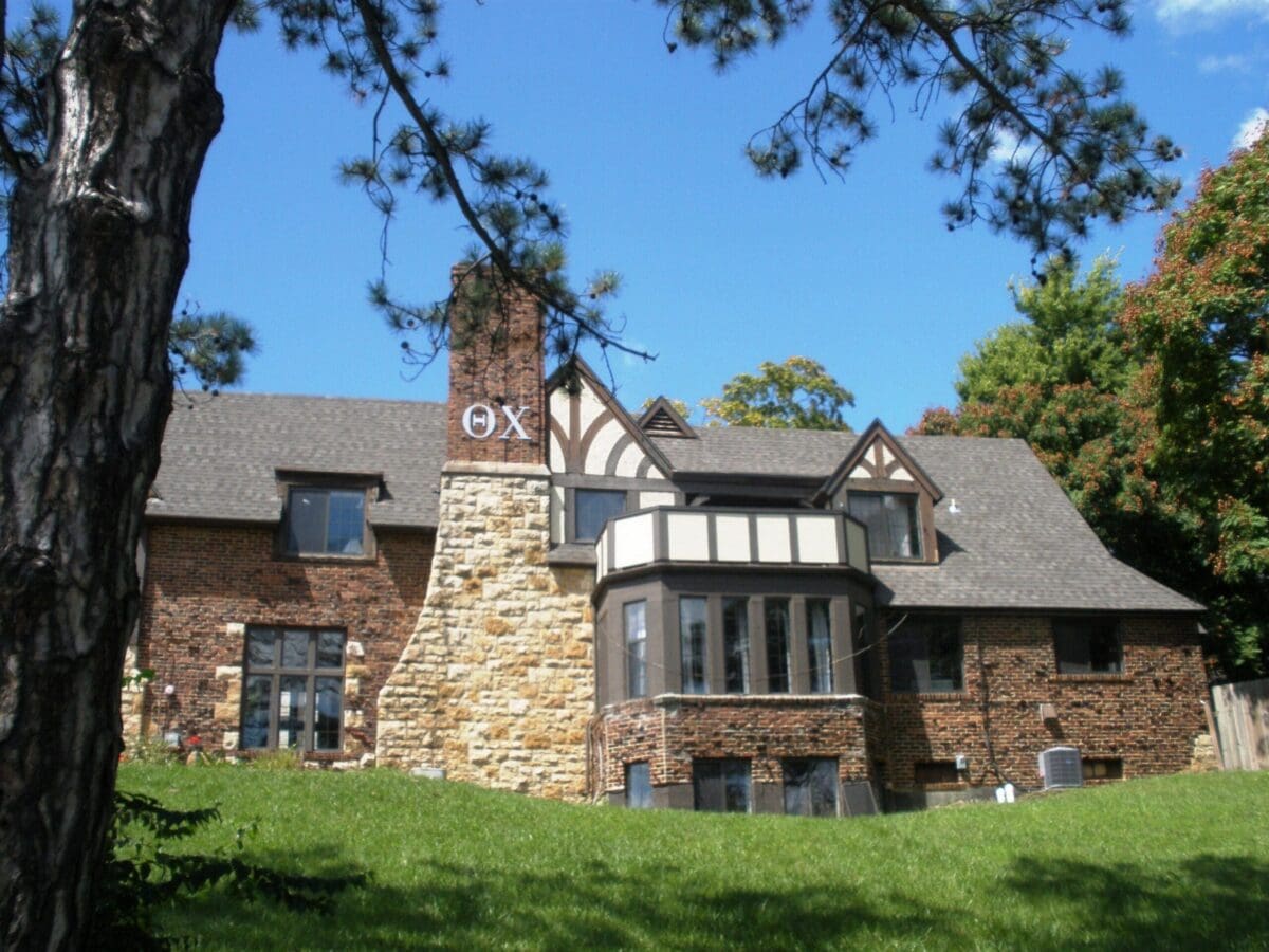 Historic stone house with a large chimney.