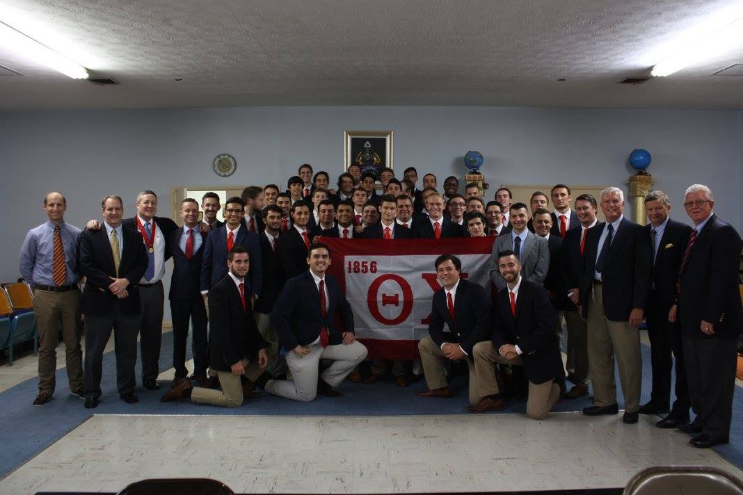 Group photo with fraternity members and flag, 1856.