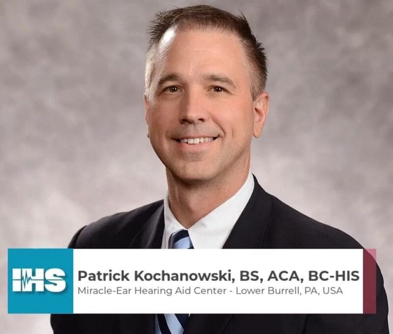 Professional portrait of Patrick Kochanowski, hearing aid specialist.