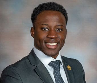 Smiling professional man in a suit and tie.