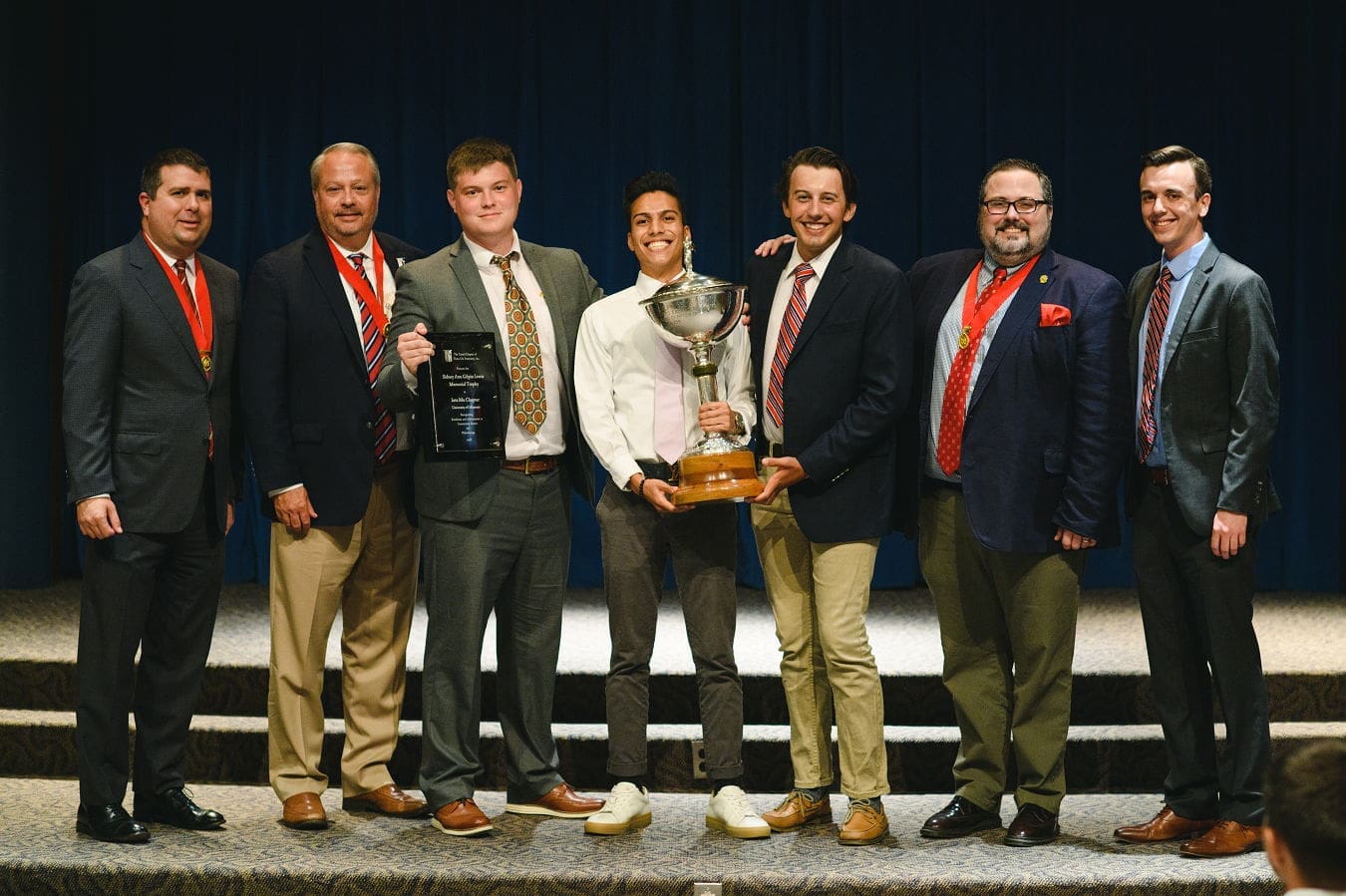 Lewis Award - 2018/2019 Award ceremony group photo with trophy presentation.