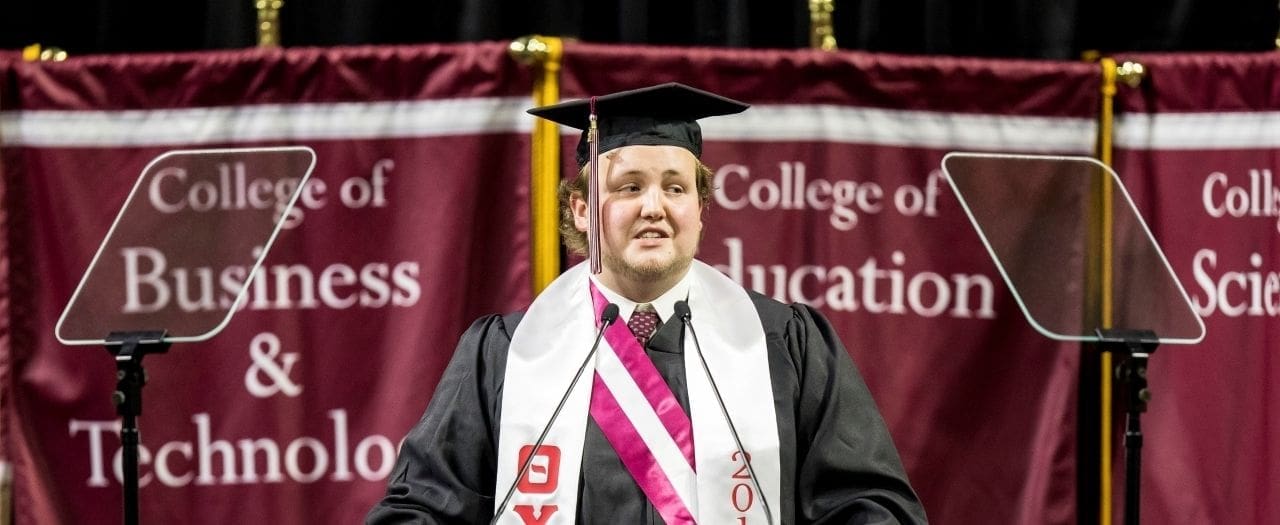Martin Rosenberger Graduation ceremony speaker in cap and gown.