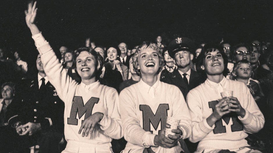 Miami Article Cheerleaders celebrating at a lively event.