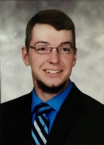 Nathaniel Hall Young man in suit and tie, smiling portrait.