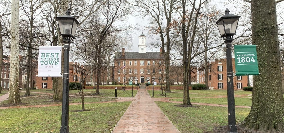 Ohio U Historic campus building with pathway and trees.