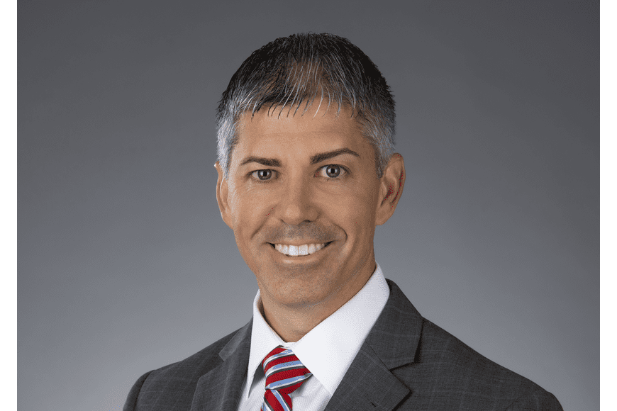 Pat Kilbane Professional man in suit with short hair.