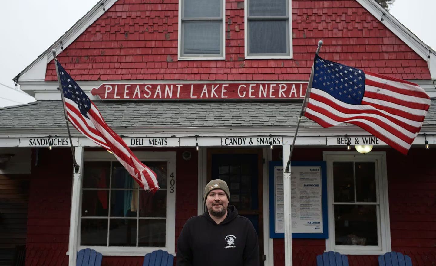 Man standing in front of Pleasant Lake General Store.