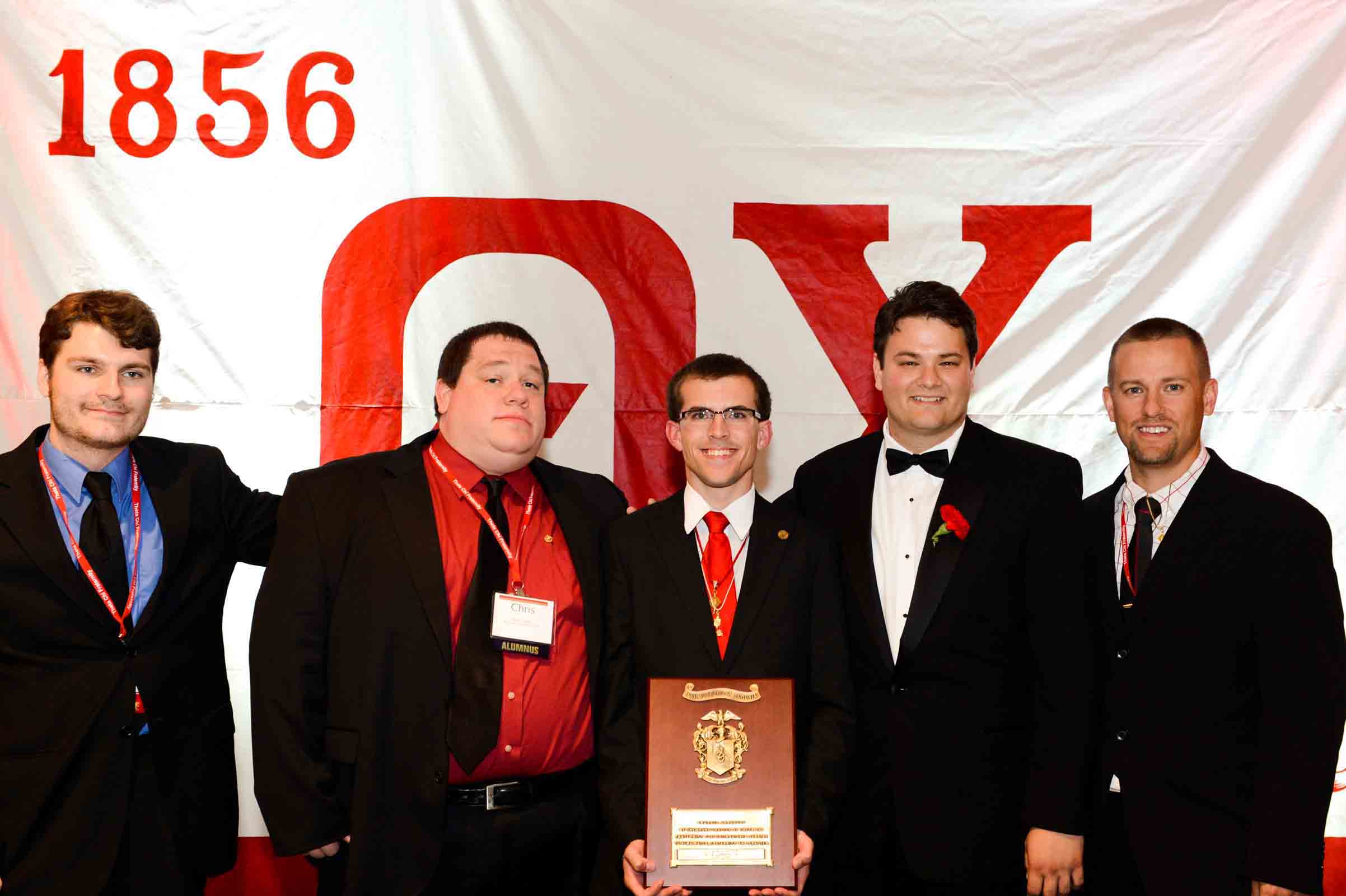 Group photo at a formal award ceremony.