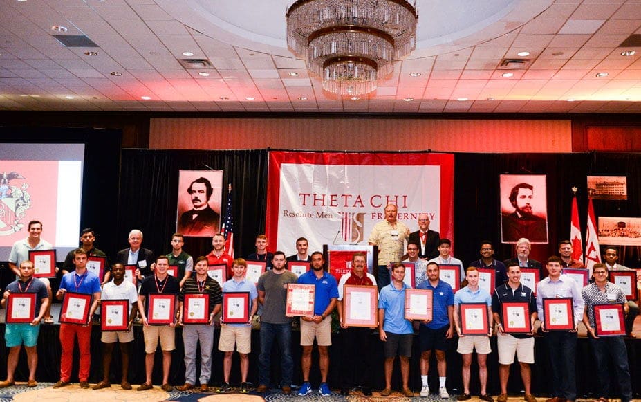 Theta Chi fraternity members at award ceremony event.