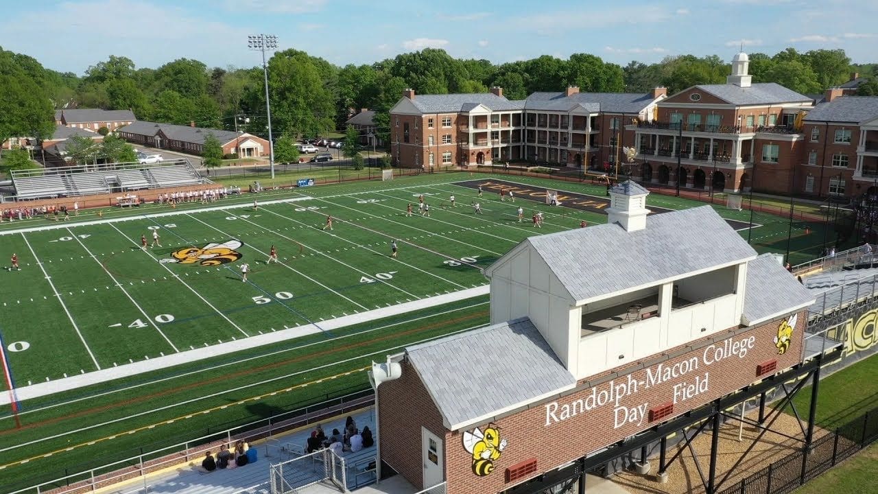 Randolph-Macon College football field with students playing.