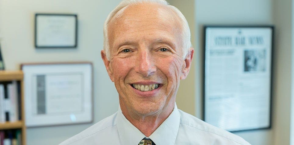 Robert Witmer Smiling older man in a professional setting.