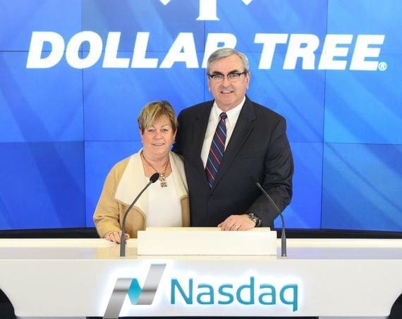 Couple celebrating Dollar Tree at Nasdaq event.