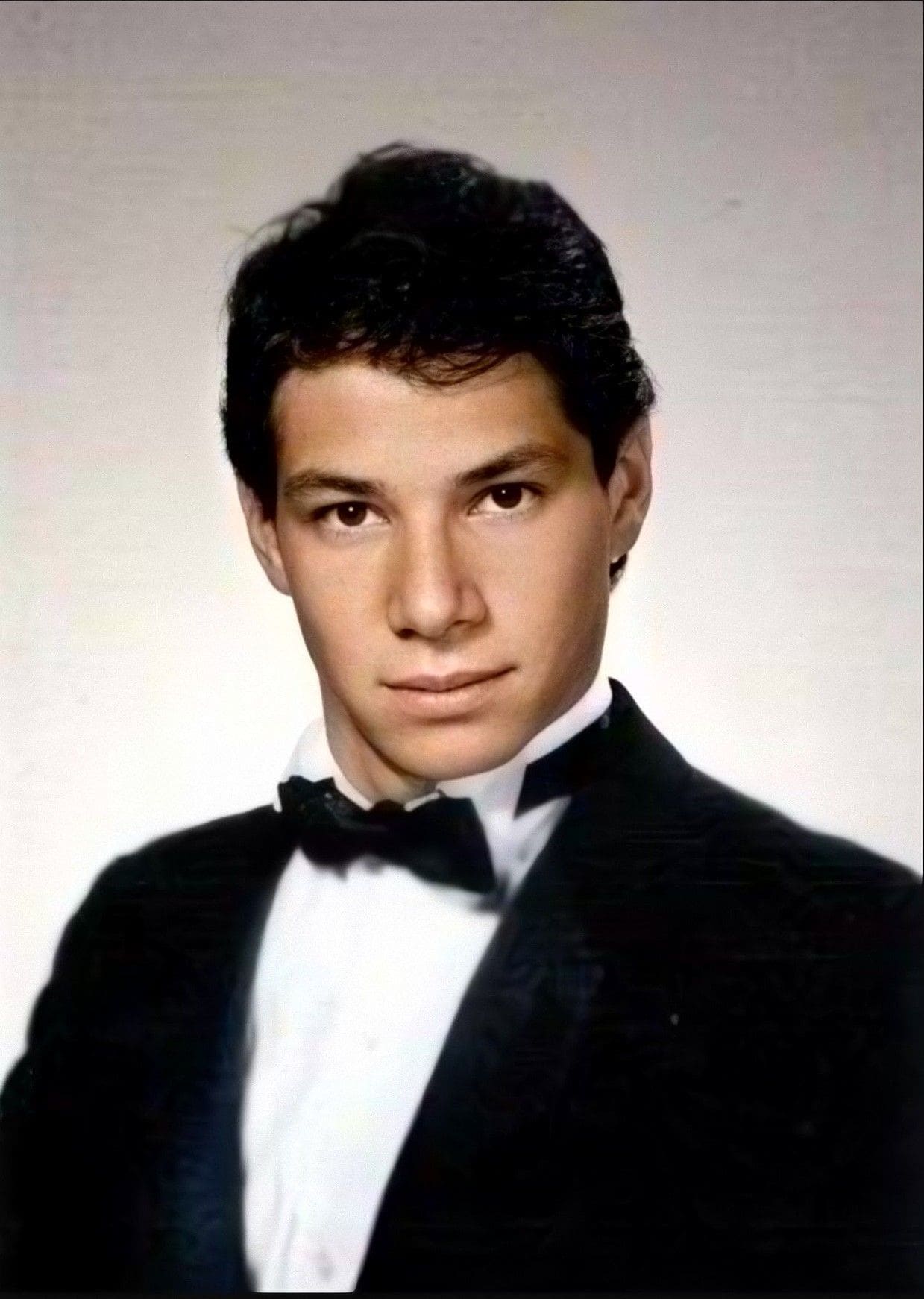 Young man in a tuxedo with bow tie.