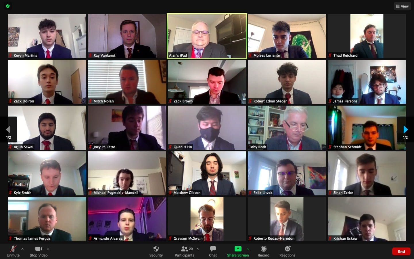 Boston Universit Virtual meeting with multiple participants in formal attire.