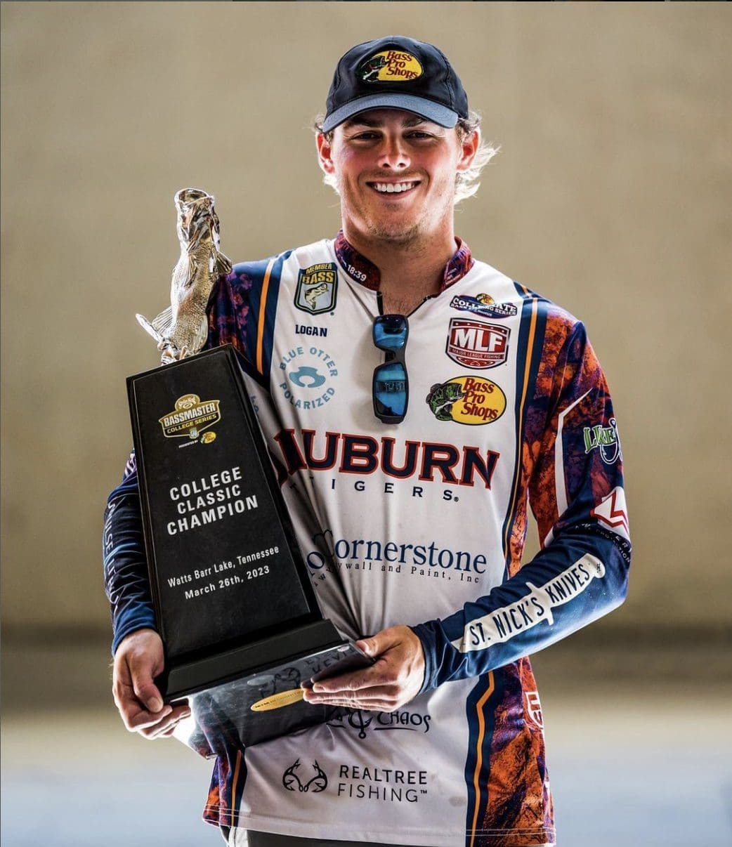 College fishing champion holding trophy, Auburn University.