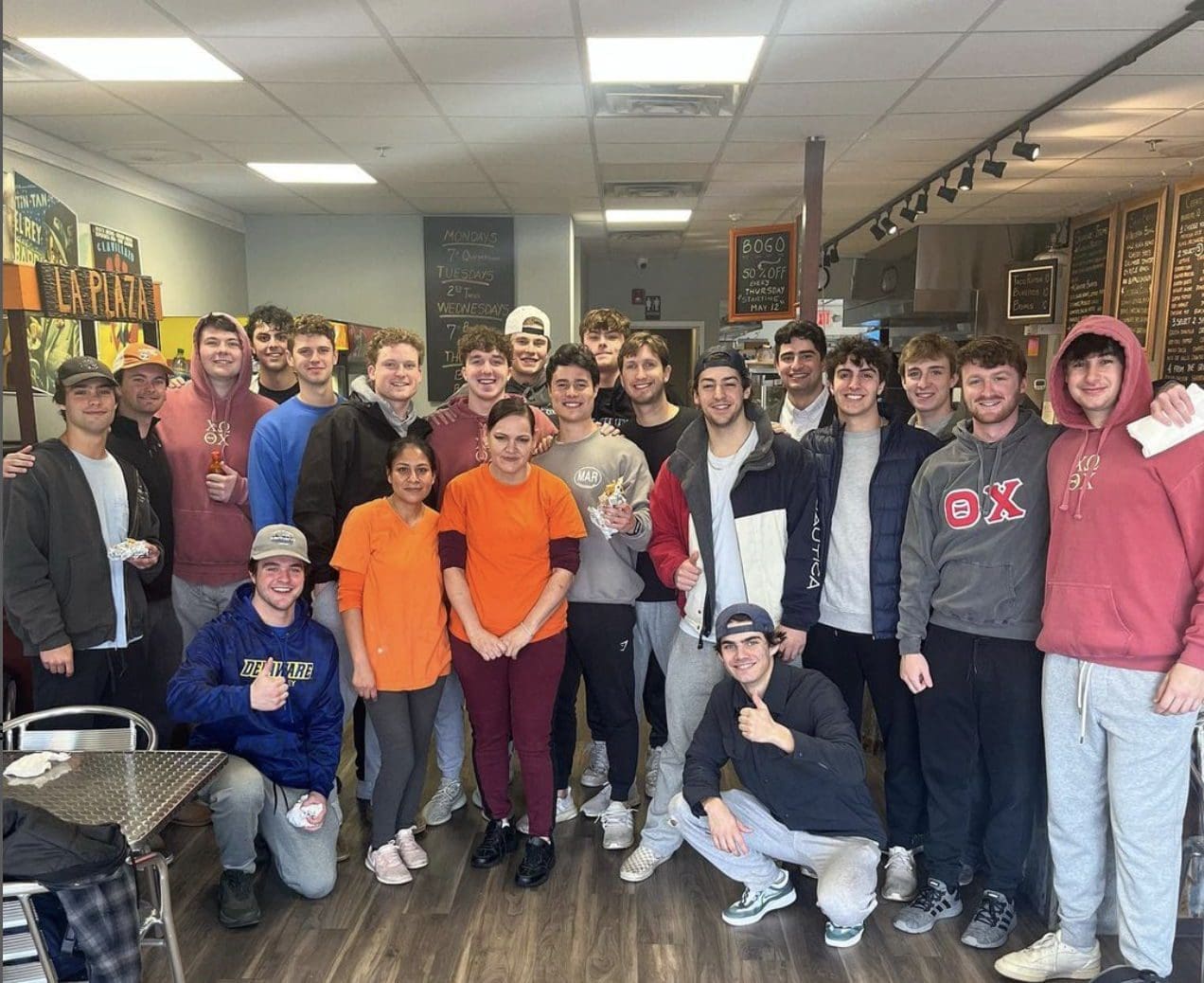 Group of students enjoying food at a local cafe.