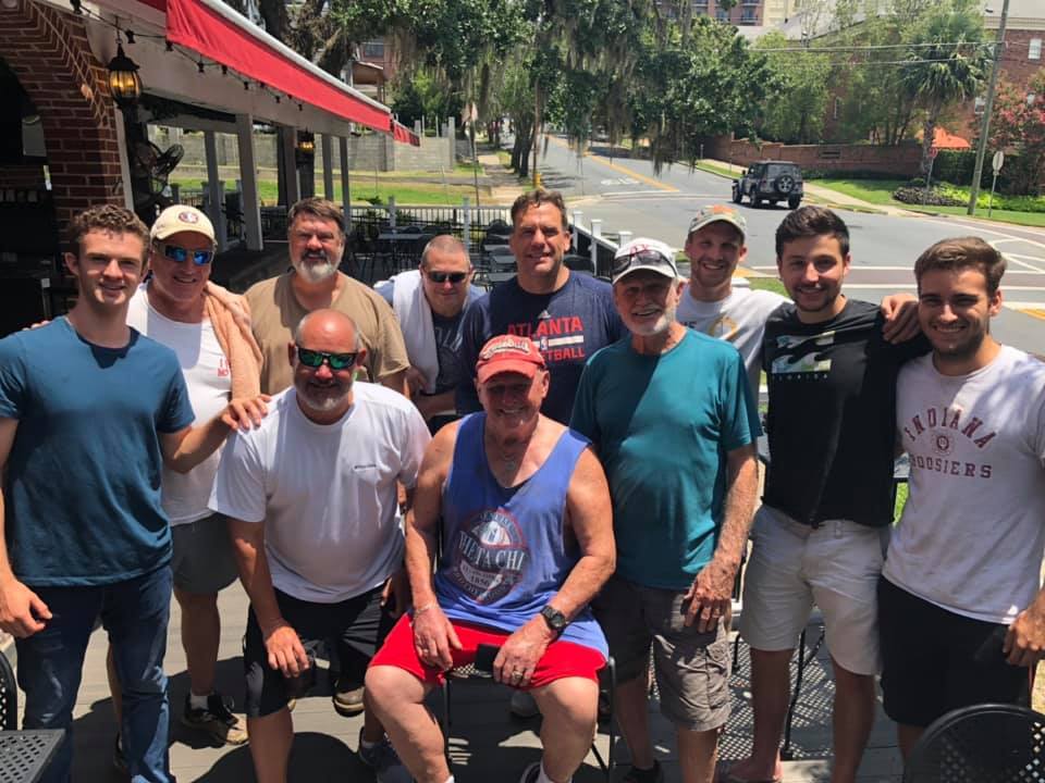 Group of friends enjoying a sunny outdoor gathering.