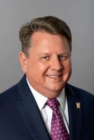 Professional man in suit with a friendly smile.