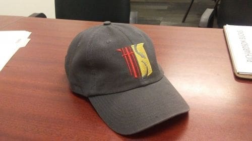 Gray baseball cap with colorful logo design.