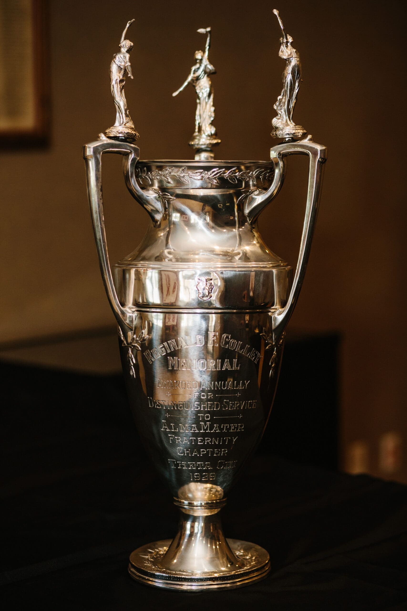 Colley Trophy Silver trophy with engraved details and ornate design.