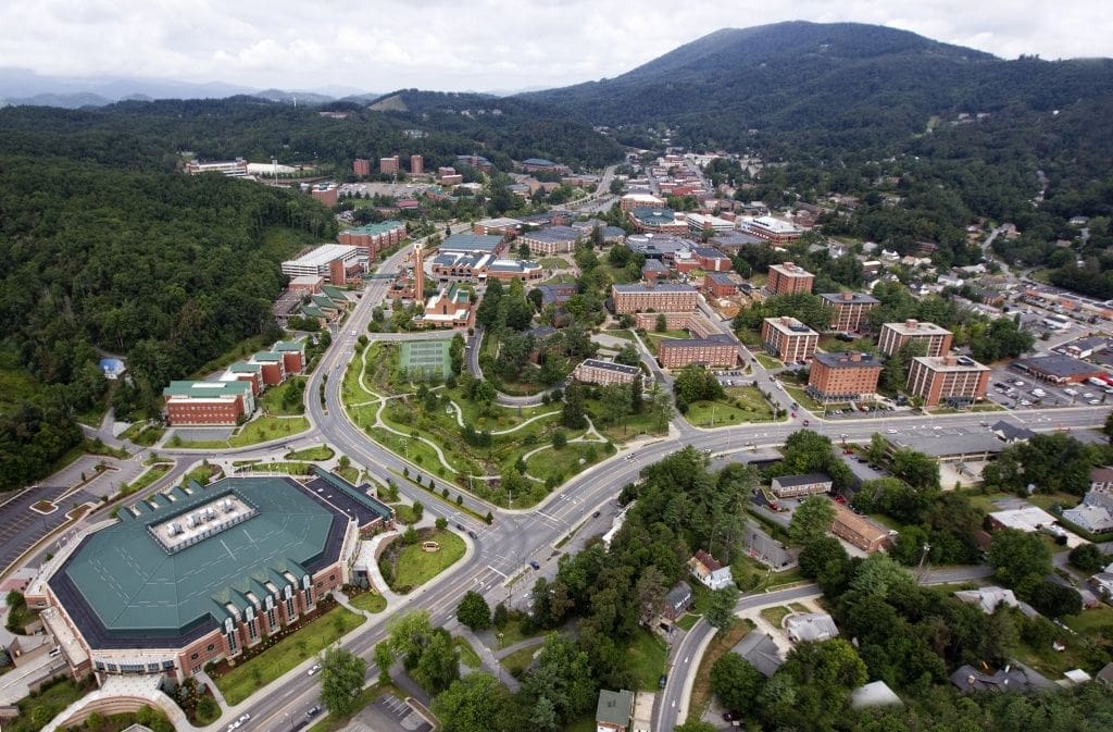 Aerial view of a college campus and surrounding area.