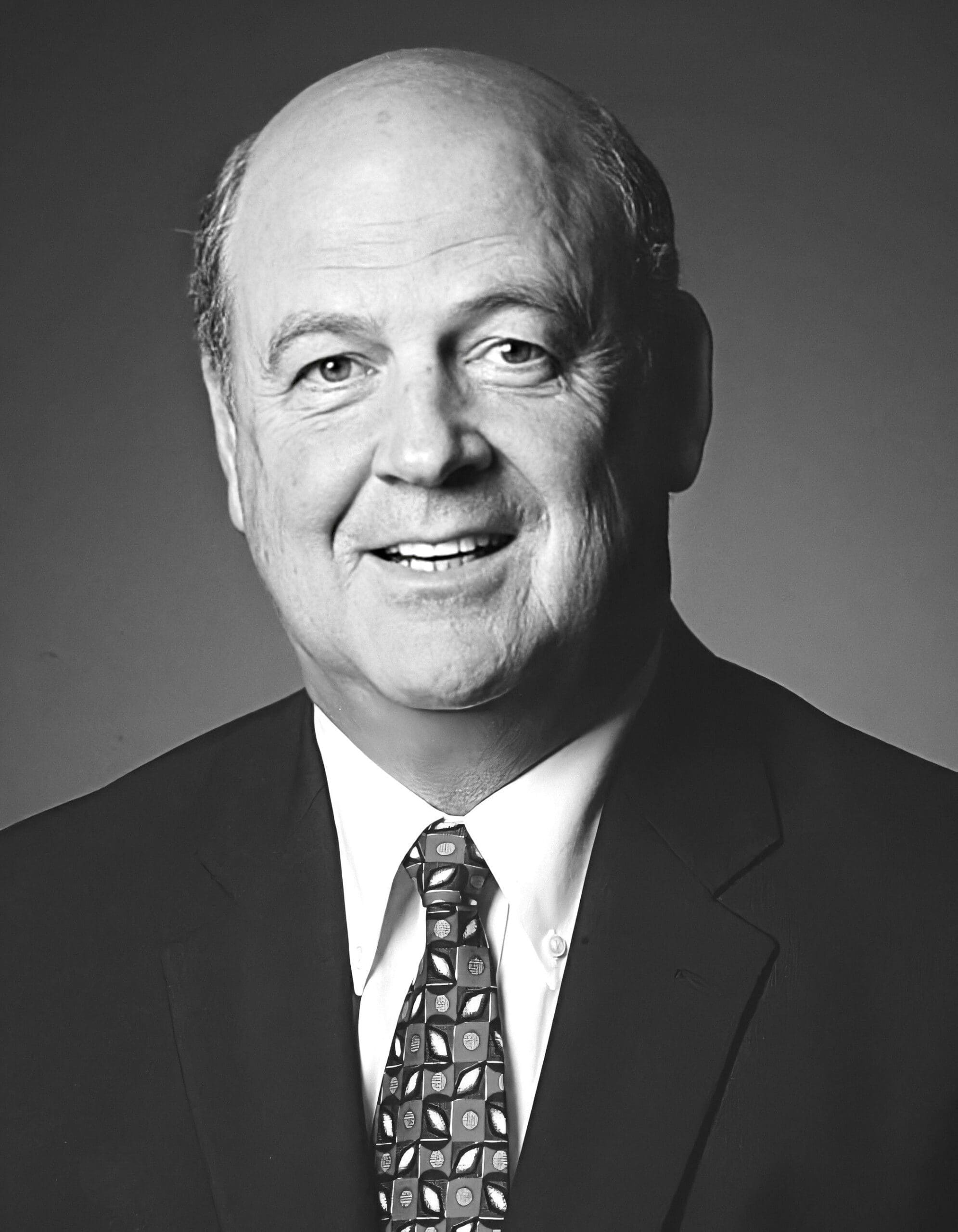 Smiling man in a suit and tie portrait.