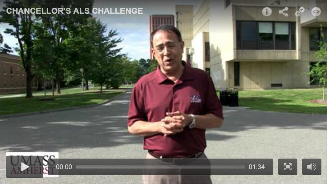 Man speaking outdoors about ALS challenge.
