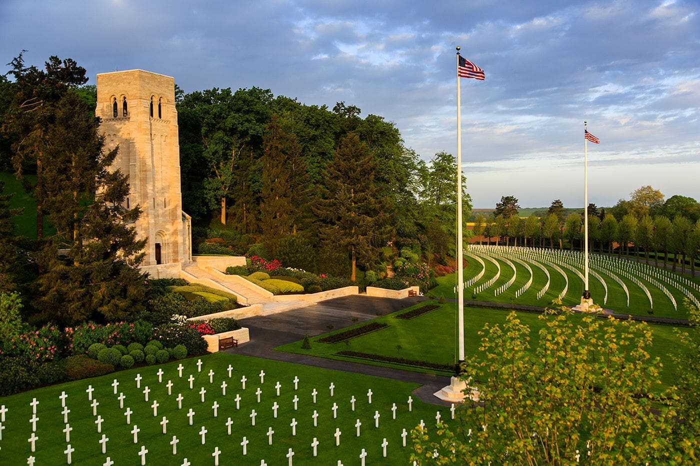 Brothers KIA during WWI American cemetery with white crosses and flag.