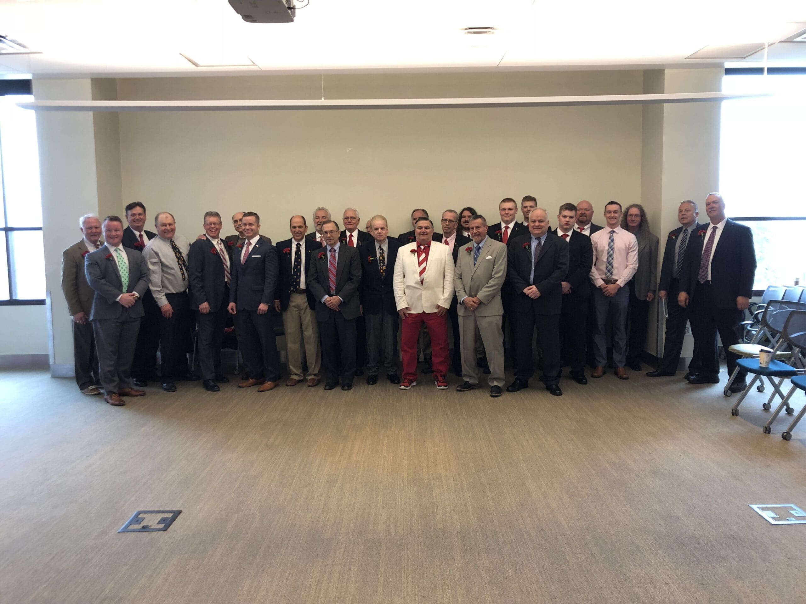 Group of professionals posing for a formal photo.