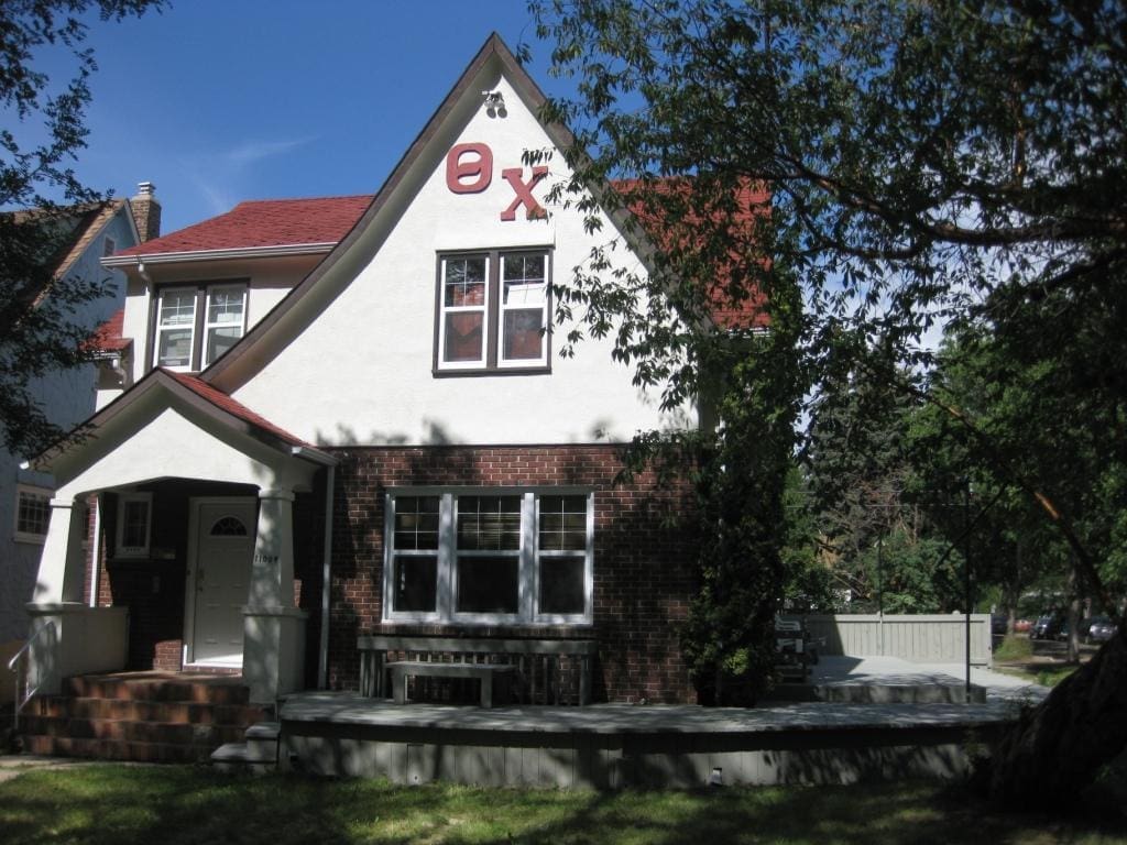 Historic home with distinctive architecture and greenery.