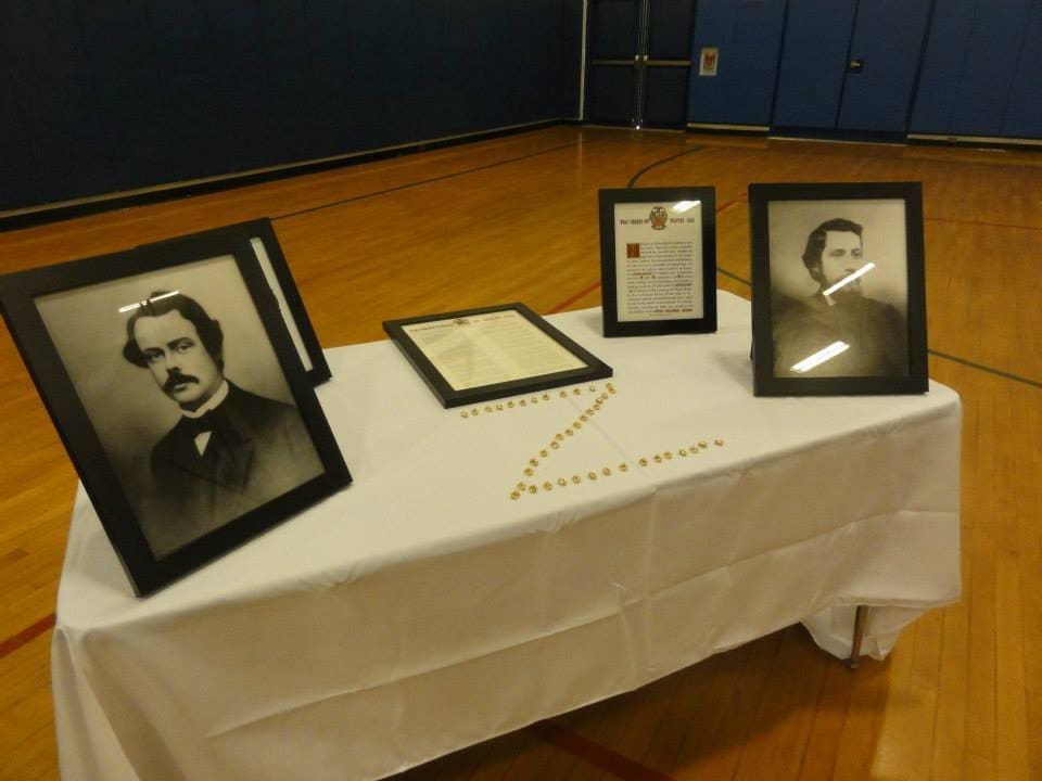 Historical photographs displayed on a table.