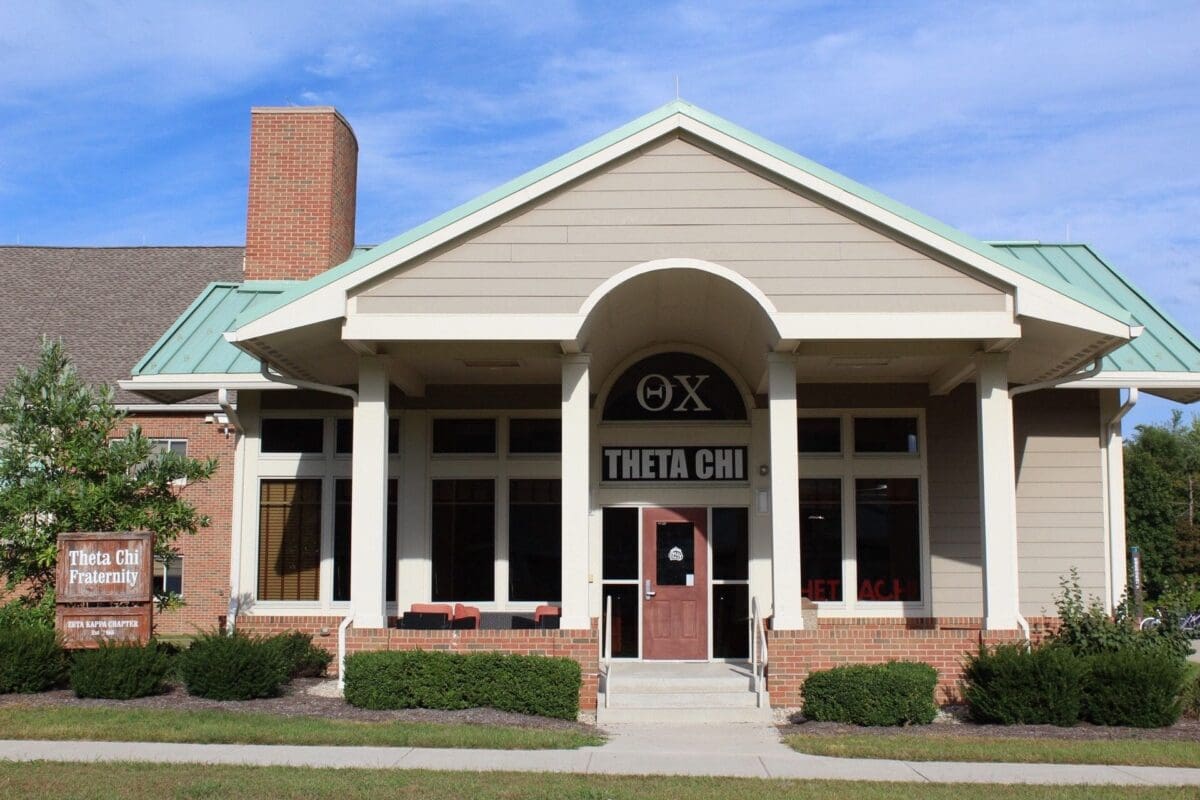 Theta Chi fraternity house exterior in daylight.