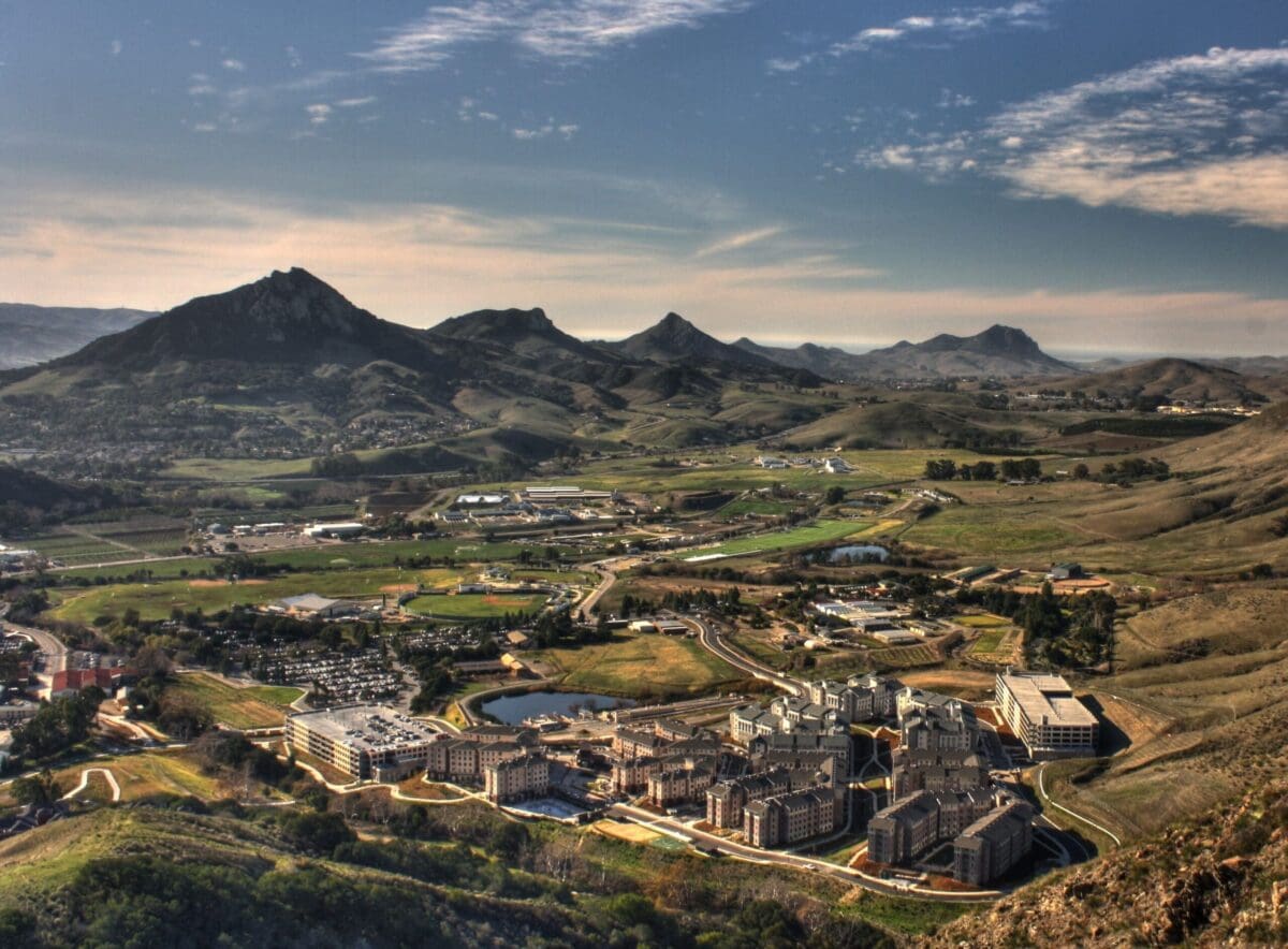 Aerial view of a sprawling valley with mountains.