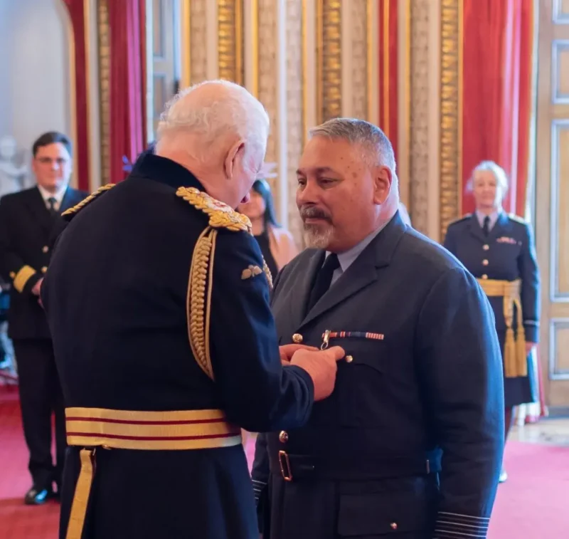 Kevin Billings being recognized with his appointment as an Officer of the Order of the British Empire