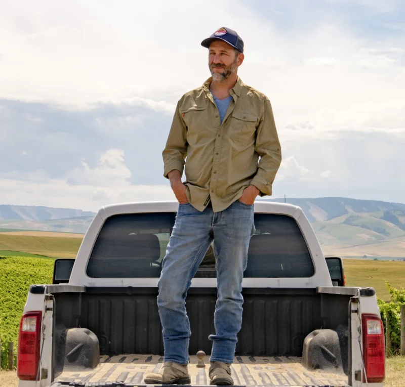 Trey Busch standing in the bed of a truck