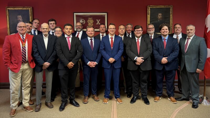 Men standing together in suits