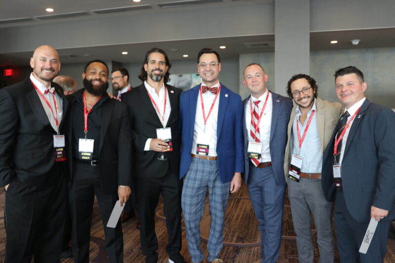 Brothers standing together at the Foundation Chapter auction.