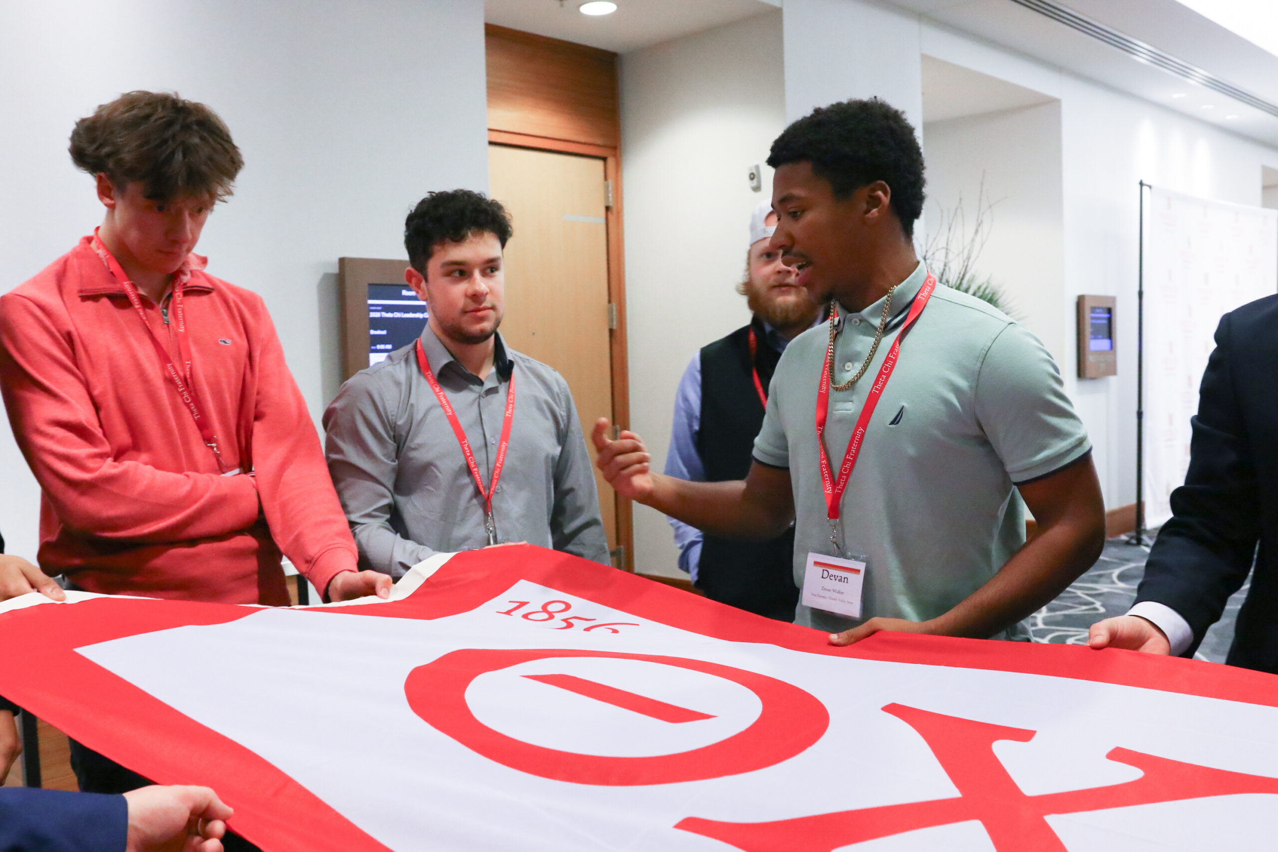 Brothers holding the flag during the Marshalls Summit