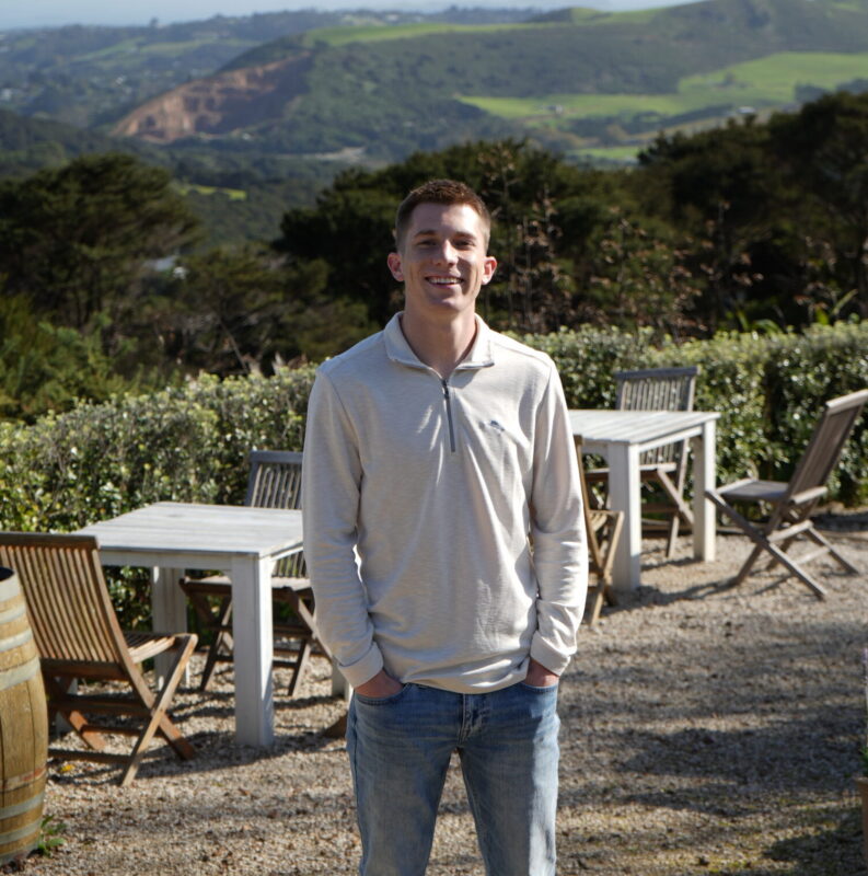 Cortland Dickman standing in a vineyard
