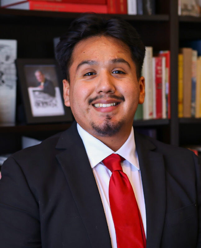 Man in a suit and tie smiling