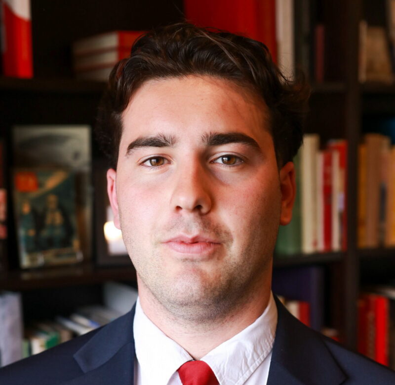 Man in suit posing for a photo