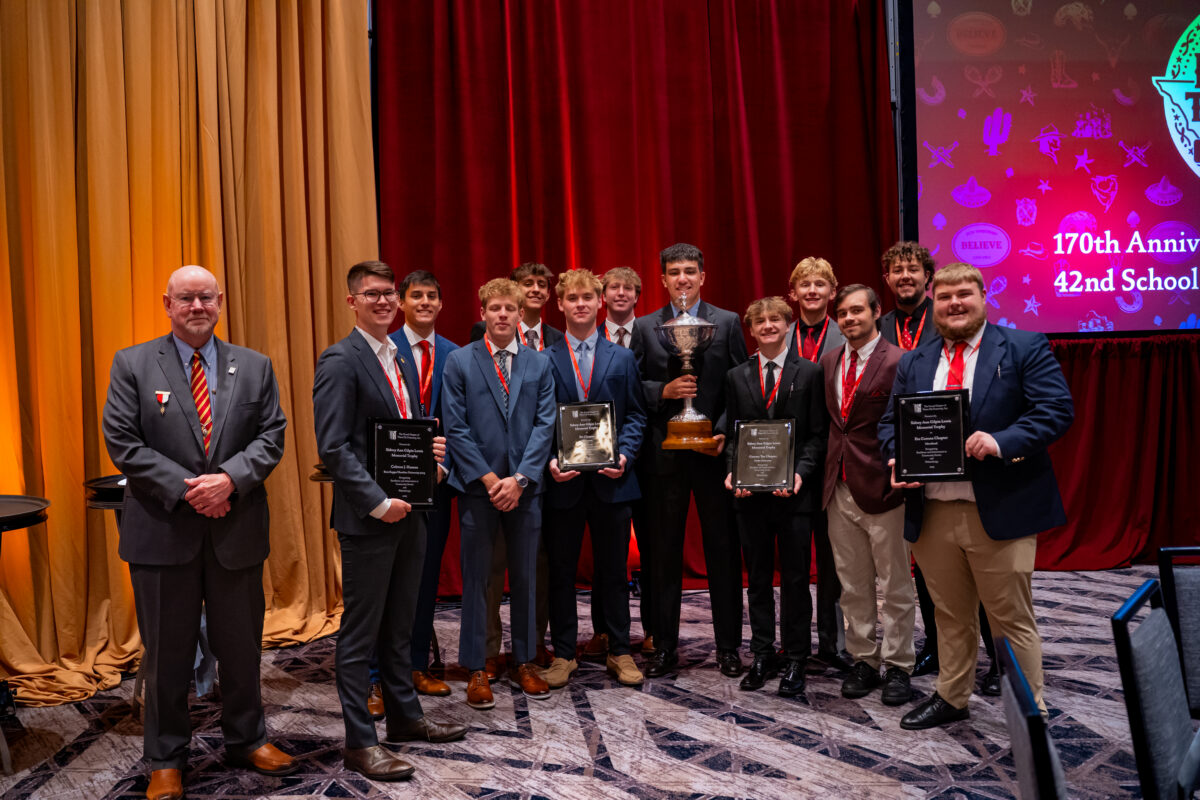 Lewis Award Recipients with the Lewis Memorial Tropy and International Chaplain Jim McMahon.