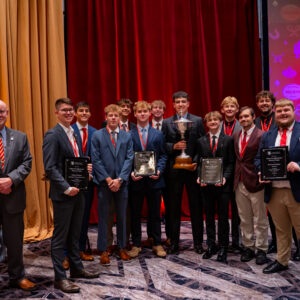 Lewis Award Recipients with the Lewis Memorial Tropy and International Chaplain Jim McMahon.
