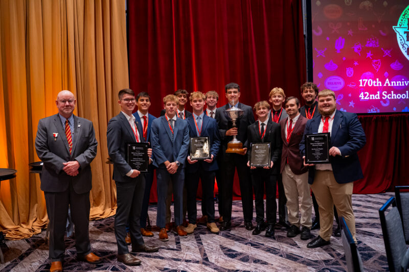 Lewis Award Recipients with the Lewis Memorial Tropy and International Chaplain Jim McMahon.